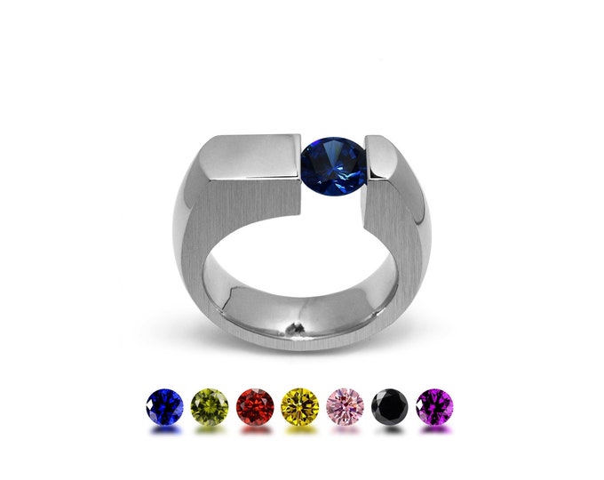 COLONNA Flat style ring with a off centered tension set colored gemstone in stainless steel by Taormina Jewelry