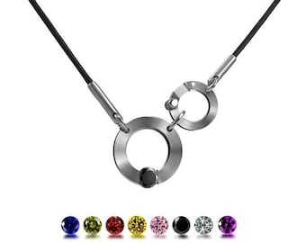 ABBRACCI necklace with round center design and tension set colored gemstone, side round clasp in stainless steel by Taormina Jewelry