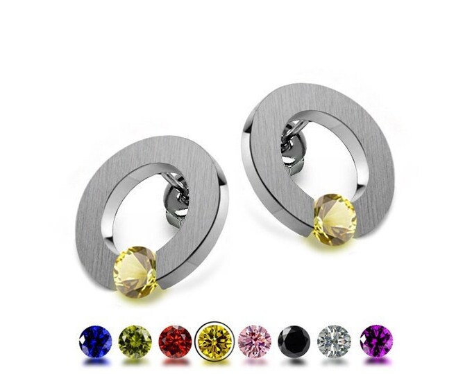 ABBRACCI Yellow Sapphires tension set round flat stud earrings in stainless steel by Taormina Jewelry