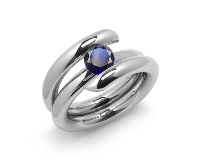 1.5ct Blue Sapphire high setting bypass tension set ring in stainless steel by Taormina Jewelry