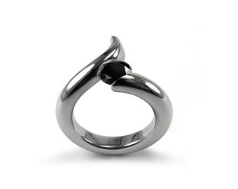 ONDE Swirl bypass ring with tension set black diamond in stainless steel by Taormina Jewelry