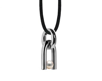 Diapason shaped pendant with tension set White Pearl in stainless steel by Taormina Jewelry