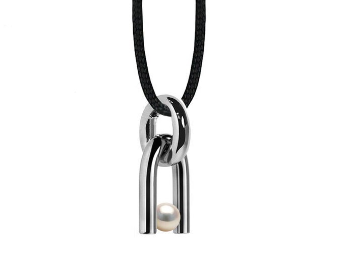 DIAPASON shaped pendant with tension set White Pearl in stainless steel by Taormina Jewelry