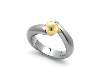 ONDE Swirl Bypass ring with tension set gold sphere in stainless steel by Taormina Jewelry