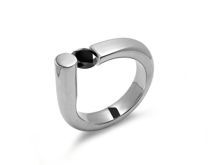 COLONNA Rounded style ring with a off centered tension set black diamond in stainless steel by Taormina Jewelry