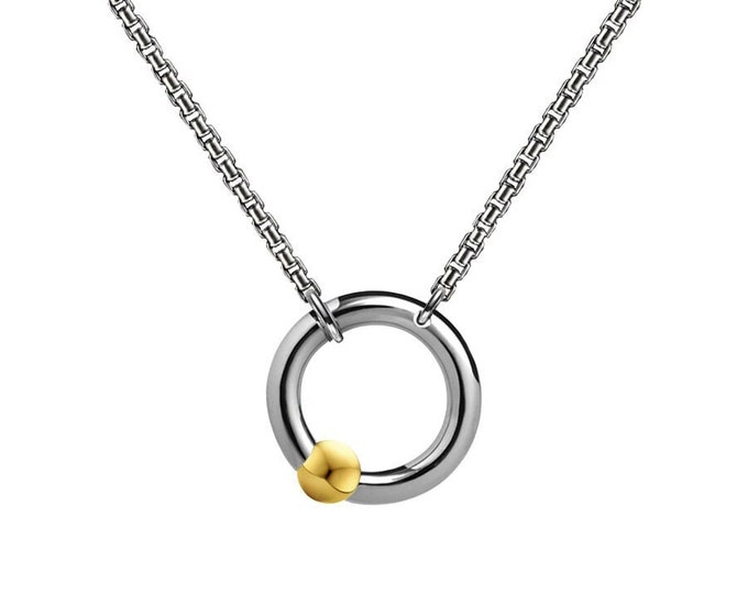 LUNA round tubular pendant with an off centered tension set gold sphere on a box chain in stainless steel by Taormina Jewelry