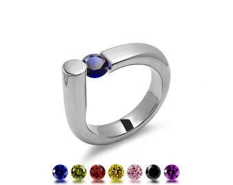 COLONNA Rounded style ring with a off centered tension set colored gemstone in stainless steel by Taormina Jewelry