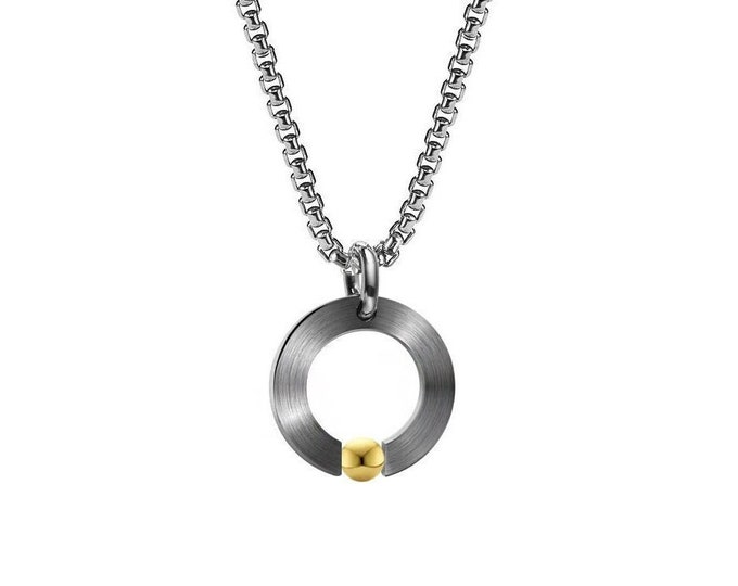 ABBRACCI round flat pendant with tension set gold sphere in stainless steel by Taormina Jewelry