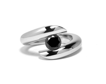 ONDE tubular bypass ring with tension set black diamond in stainless steel by Taormina Jewelry