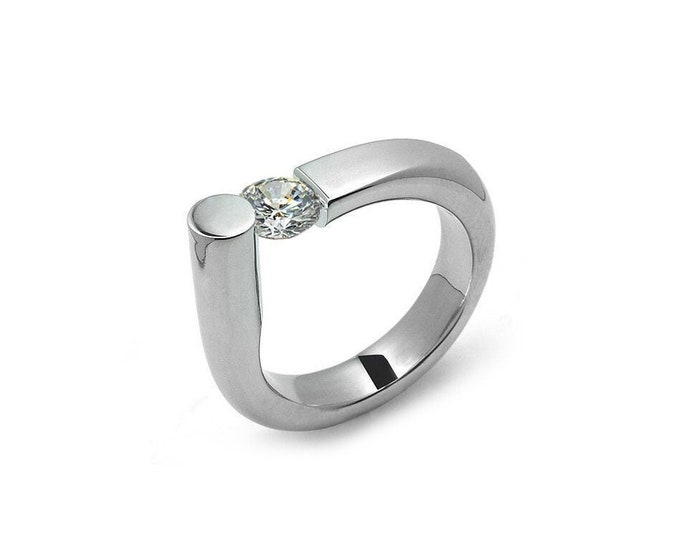 COLONNA Rounded style ring with a off centered tension set white sapphire in stainless steel by Taormina Jewelry