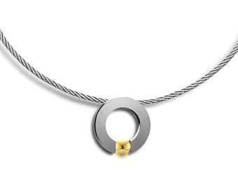 ABBRACCI round flat pendant with tension set gold sphere on a cable choker in stainless steel by Taormina Jewelry