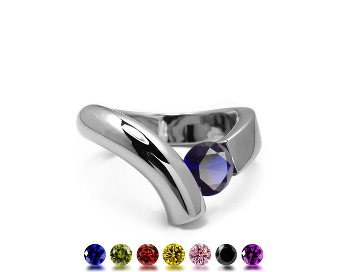 ONDE Flat and tubular bypass ring with tension set colored gemstone in stainless steel by Taormina Jewelry