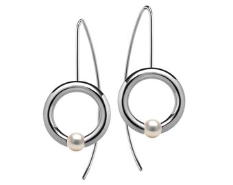 LUNA round tubular drop earrings with tension set white pearls in stainless steel by Taormina Jewelry