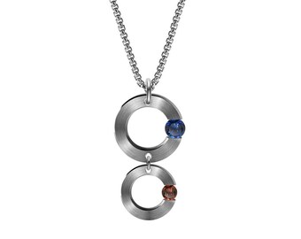 ABBRACCI double flat round pendant with off side tension set gemstones in stainless steel by Taormina Jewelry