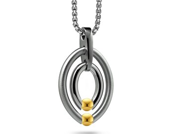 OVUM double oval pendant with tension set gold spheres in stainless steel