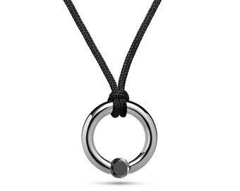 LUNA circular tubular pendant with tension set black diamond in stainless steel