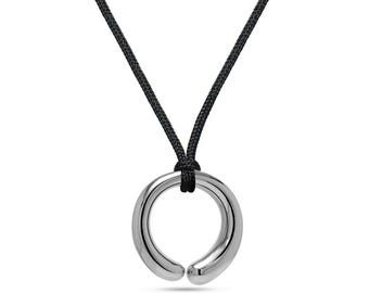 Mother & Child round tubular pendant on a cord in stainless steel