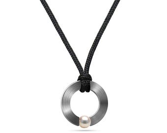 ABBRACCI flat round pendant with tension set white pearl in stainless steel on a cord