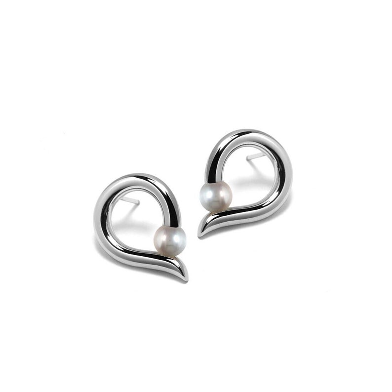 ONDE Teardrop shaped stud earrings with tension set white pearl in stainless steel by Taormina Jewelry image 1