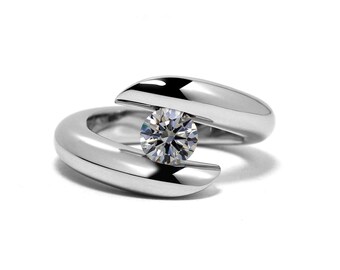 ONDE tubular bypass ring with tension set white sapphire in stainless steel