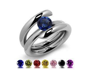 ILIANA High rise tubular bypass ring with tension set colored gemstone in stainless steel
