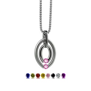 OVUM double oval tubular pendant with tension set colored gemstones in stainless steel by Taormina Jewelry pink sapphire