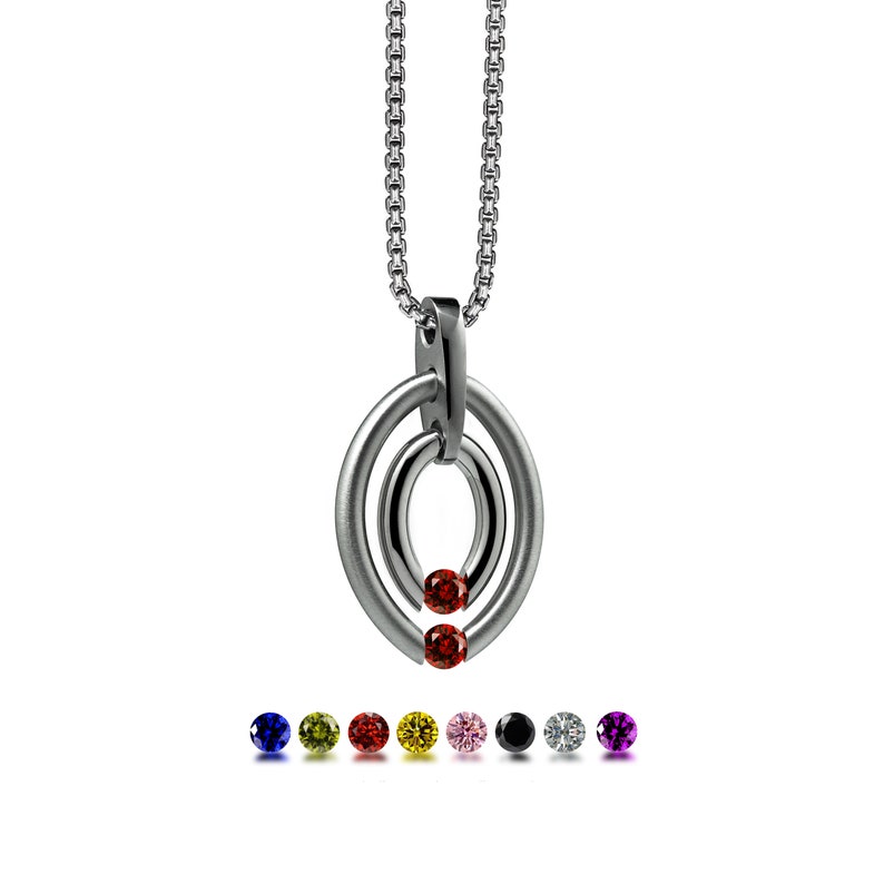 OVUM double oval tubular pendant with tension set colored gemstones in stainless steel by Taormina Jewelry garnet