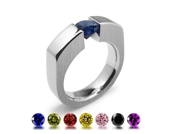ABBRACCI Flat sides tension set ring with tension set colored gemstones in stainless steel
