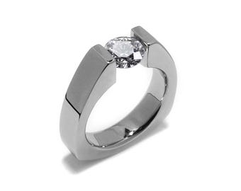 PYRAMID Triangular shaped ring with a tension set white sapphire  in stainless steel