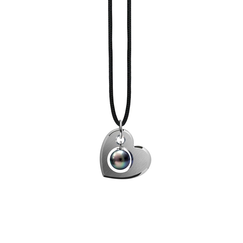 CUORE open hart pendant with black pearl dangling in the center in stainless steel by Taormina Jewelry cord