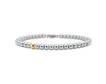 5mm beaded bracelet with a single gold bead in stainless steel