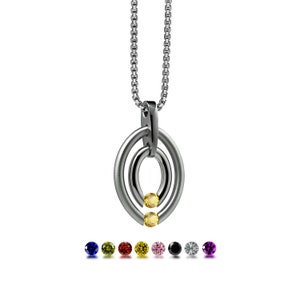 OVUM double oval tubular pendant with tension set colored gemstones in stainless steel by Taormina Jewelry yellow sapphire