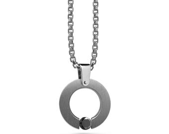 ABBRACCI flat round pendant with tension set black diamond in stainless steel