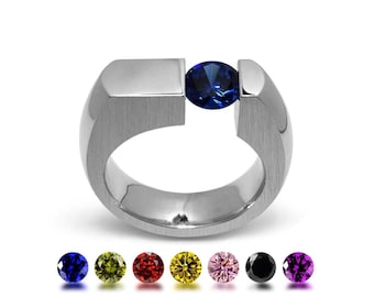 COLONNA Flat style pinky ring with a off centered tension set colored gemstone in stainless steel