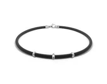 Tubular 5mm black rubber necklace with rondels and lobster clasp in stainless steel