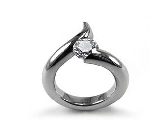 ONDE Swirl bypass ring with tension set white sapphire in stainless steel
