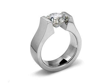 PETRA Flat high setting ring with a tension set white sapphire in stainless steel
