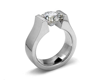 PETRA Flat high setting ring with a tension set white sapphire in stainless steel