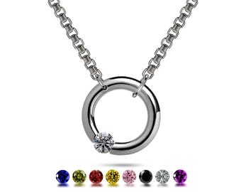 LUNA round tubular pendant hanging on a chain with off centered tension set colored gemstone in stainless steel