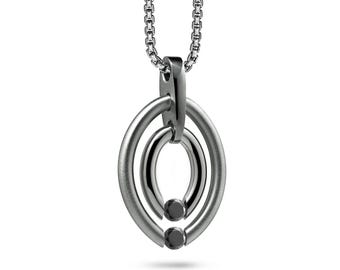 OVUM double oval tubular pendant with tension set black diamonds in stainless steel