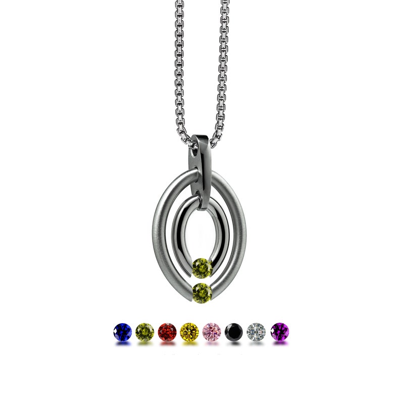 OVUM double oval tubular pendant with tension set colored gemstones in stainless steel by Taormina Jewelry peridot