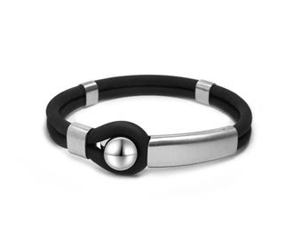 Double tubular black rubber bracelet and stainless steel center piece