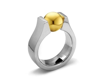 PETRA high setting ring with tension set gold sphere in stainless steel