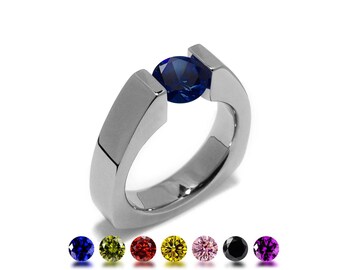 PYRAMID Triangular shaped ring with tension set colored gemstone in stainless steel