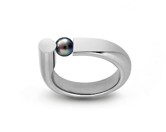 PORTANTE Flat and tubular ring with off centered tension set Black Pearl in stainless steel