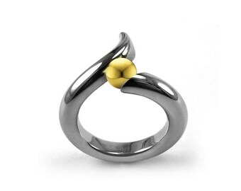 ONDE Swirl bypass ring with tension set gold sphere in stainless steel