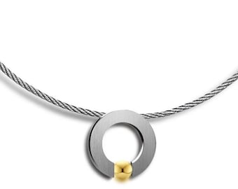 ABBRACCI round flat pendant with tension set gold sphere on a cable choker in stainless steel