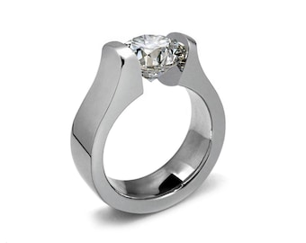 MAREA Flat and rounded high mounting ring with tension set white sapphire in stainless steel