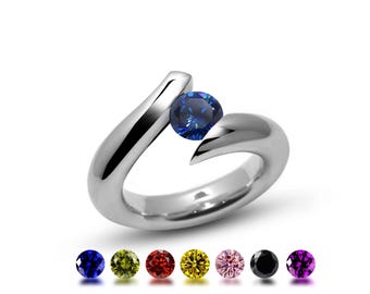 ONDE Bypass ring with tension set colored gemstone in stainless steel