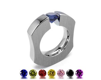 ABBRACCI Ergonomic ring with tension set gemstone in stainless steel
